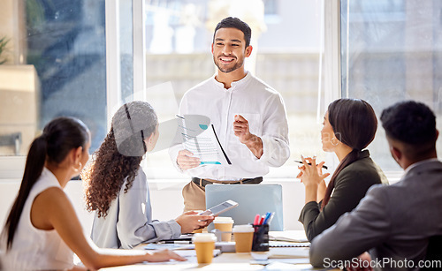 Image of Staff, presentation and business man in a meeting, teamwork and planning with brainstorming, feedback and review. Presenter, group and team share ideas, collaboration and partnership with documents