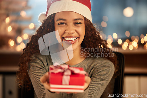Image of Portrait, celebration and woman with a gift, Christmas and excited with happiness, Santa hat and box. Face, female person and girl with a parcel, Xmas present and smile with festive season and event