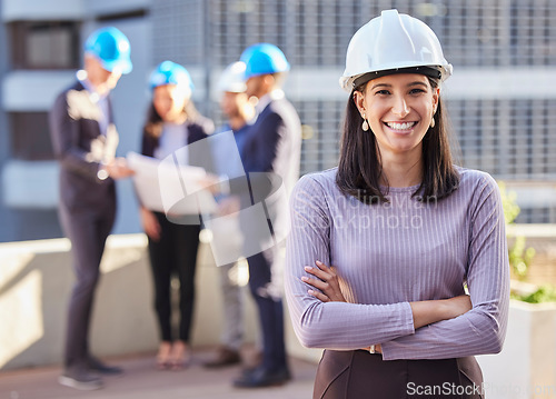 Image of Happy woman, portrait and architect with arms crossed for construction in team management or leadership on site. Confident female person, engineer or manager with hard hat for industrial architecture