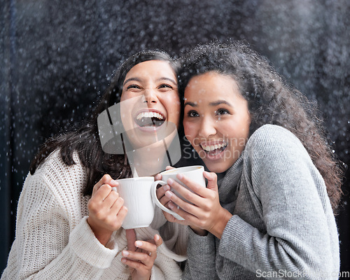 Image of Women, friends and snowfall with coffee, laugh and happiness together on holiday with warm drink. Snow, girl or woman in winter with laughing, love and happy with matcha, espresso or latte outdoor