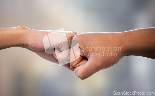 Image of Hands, friends and fist bump outdoor in support of solidarity, teamwork or collaboration on blurred background. Hand, unity and people greeting, gesture or respect outside with power, fists and deal