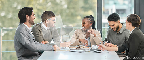 Image of Business people, boardroom and meeting with talk, laugh and comic joke together at financial agency. Men, women and happiness with diversity, conversation and teamwork for finance solution with group