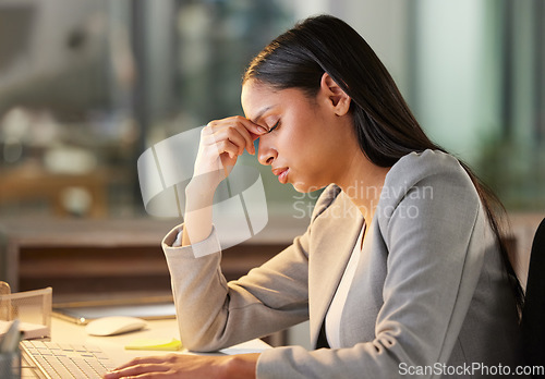 Image of Headache, stress and business woman in night office for burnout, fatigue or mental health problem. Breathing, pain and sad or depressed professional person at her desk for mistake, depression or fail