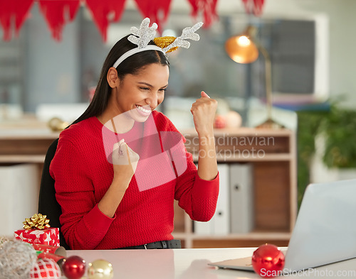 Image of Christmas, laptop and business woman winning, yes and success on e commerce website, sales or discount in office. Fist, cheers and celebration of winner or african person on computer for holiday news