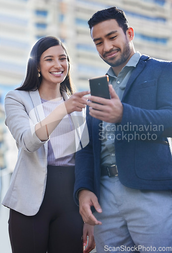 Image of Phone, business people and team outdoor in a city with internet connection for social media. A happy man and woman together on urban background with smartphone for networking, communication or app