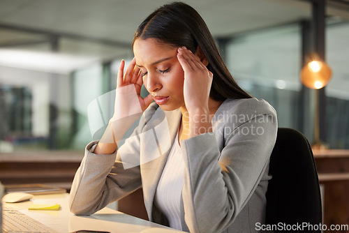 Image of Headache, pain and stress of business woman in office burnout, fatigue or mental health risk at night. Migraine, massage temple and tired professional person at desk of mistake, depression or anxiety