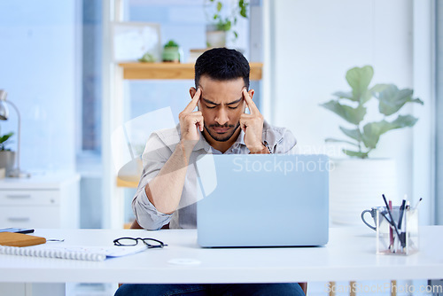 Image of Mental health, businessman with a headache and laptop on his desk in office at workplace. Anxiety or depression, mistake or problem and male person frustrated or stress sitting at his workstation