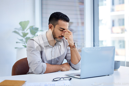 Image of Business, stress and man with a headache, laptop and overworked with health issue, professional and pain. Male person, employee or entrepreneur with a pc, burnout and migraine with fatigue or problem