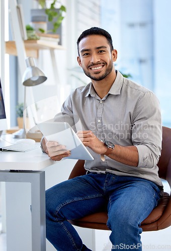 Image of Professional, man and tablet in portrait working as entrepreneur with a smile for a startup at a desk. Business person, male and tech in a company for research is typing online with ideas.