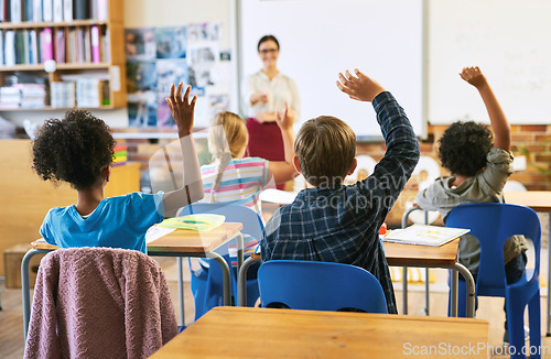 Image of Education, question with group of children in classroom and raise their hands to answer. Learning or support, diversity and teacher teaching with young students in class of school building together