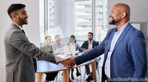 Image of Meeting, smile and hand shake with businessmen in office, b2b deal or agreement for startup opportunity. Handshake, partnership and welcome, happy man shaking hands with boss and onboarding with team