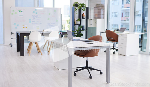 Image of Presentation, workspace and conference room with table and whiteboard, interior of business office of company. Still life, meeting space for innovation and ideas with furniture in professional setup