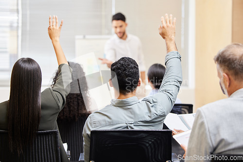 Image of Business presentation, audience and people hands for questions in training, workshop or feedback. Seminar, coaching and crowd with hand vote, answer or idea for mentor, speaker or business man leader