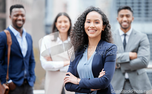 Image of Business woman, city portrait and arms crossed outdoor with leadership and management success. Professional, team and group with a smile from company diversity and solidarity for corporate work