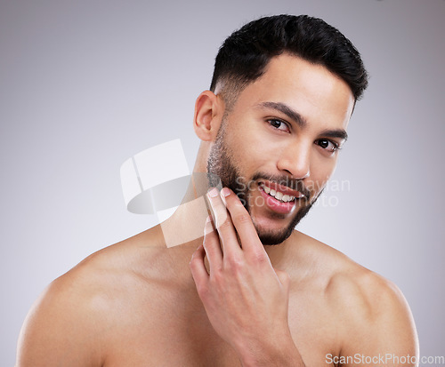 Image of Skincare, grooming and portrait of happy man in studio with natural, beauty and face routine. Self care, beard trim and male model with dermatology facial treatment for clear skin by gray background.