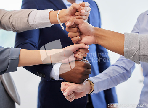 Image of Business people, fist and hands together for support, teamwork and collaboration at office. Diversity, motivation and success gesture of corporate staff with professional community and solidarity