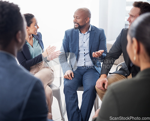 Image of Business people, meeting and discussion in circle at office for team building, planning and brainstorming collaboration. Group, diversity and employees in a huddle for talking, workshop and training