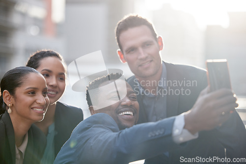 Image of Diversity, group of people take a selfie and with smartphone smile outdoors in a city background with a lens flare. Happiness, collaboration and colleagues in urban street together with smile