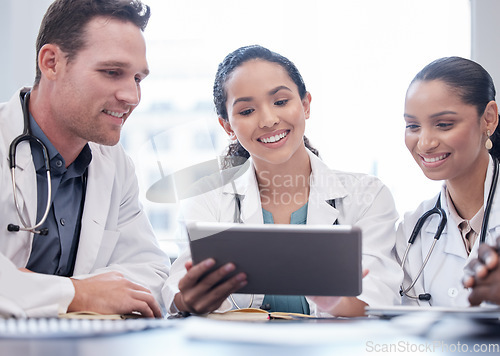 Image of Medical, tablet and collaboration with a team of doctors in the hospital boardroom for a meeting. Teamwork, healthcare and planning with a group of professional medicine people working in a clinic