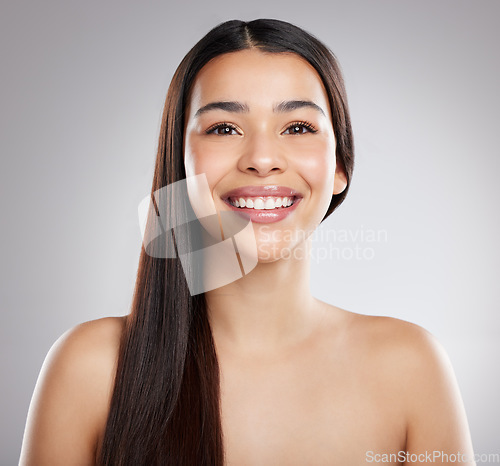 Image of Woman in portrait, hair and beauty with hairstyle and shine, haircare and growth isolated on studio background. Female model with smile, keratin treatment and cosmetic care, texture and glossy