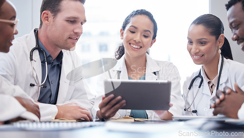 Image of Healthcare, tablet and collaboration with a team of doctors in the hospital boardroom for a meeting. Teamwork, health and planning with a group of professional medicine people working in a clinic