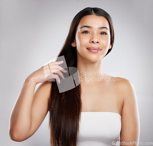 Image of Woman with smile in portrait, hair and beauty with hairstyle and shine, haircare and growth isolated on studio background. Female model, keratin treatment and cosmetic care with texture and glossy