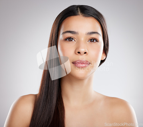 Image of Woman in portrait, face and hair, beauty with hairstyle and shine, haircare and growth isolated on studio background. Female model, salon keratin treatment and cosmetic care, texture and glossy