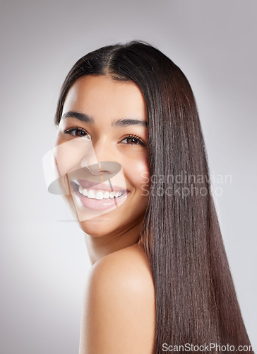 Image of Hair, haircare and happy woman with beauty and salon hairstyle, cosmetic care and portrait isolated on studio background. Female model with smile, shine and growth, Brazilian or keratin treatment