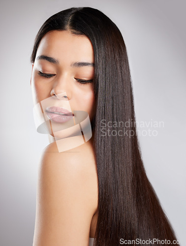 Image of Hair, hairstyle and woman with beauty and salon haircare, cosmetic care and elegance isolated on studio background. Female model with growth, shine and glossy with Brazilian or keratin treatment