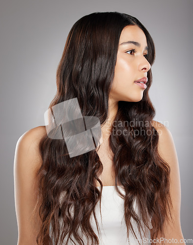 Image of Woman with hair, beauty with balayage and curly hairstyle with haircare and keratin treatment on studio background. Female person with shine and texture, growth and grooming with glamour and glossy