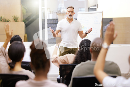 Image of Business, speaker and man in a conference room, presentation and question for corporate training. Male person, leader and staff in a workshop, feedback and coaching for growth and company development