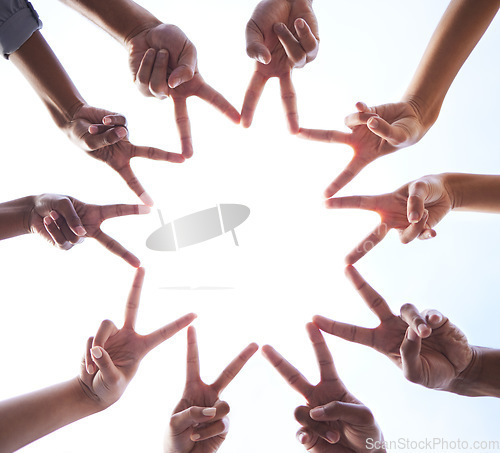 Image of Teamwork, hands and star of peace at white background for support, partnership and collaboration from below. Closeup, trust and fingers of hope, society and group solidarity for mission, goals or fun