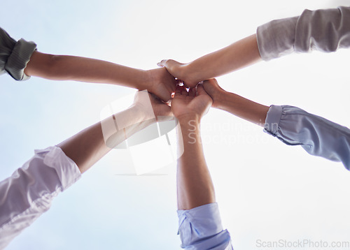 Image of Team building, hands and people high five in collaboration, support and circle of trust for motivation from below. Closeup, group and helping hand for success, mission and celebration of cooperation