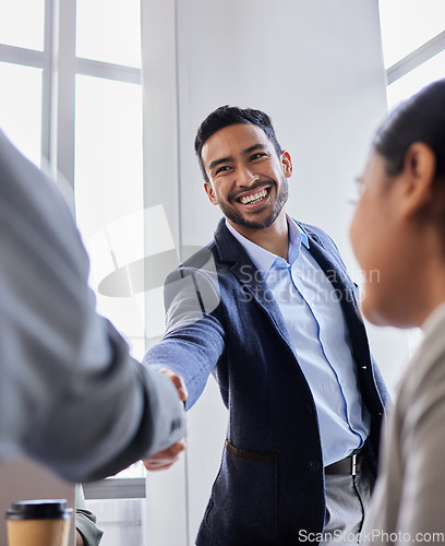 Image of Meeting, smile and handshake with business people in office, b2b deal or agreement for startup opportunity. Hand shake, partnership and welcome, happy businessman shaking hands for onboarding support