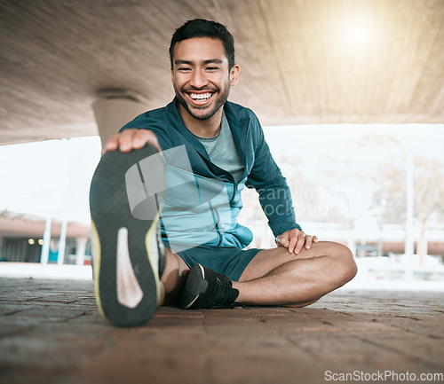 Image of Man, stretching and foot for workout and fitness in the outdoor for wellness in the city. Male athlete, stretch and legs while sitting for training and exercise for sports competition in parking.