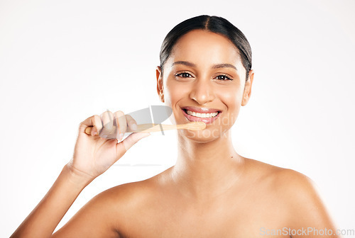 Image of Happy woman, portrait and toothbrush for clean teeth or dental hygiene against a white studio background. Female person or model with tooth brush and smile for oral, mouth or gum care on mockup space