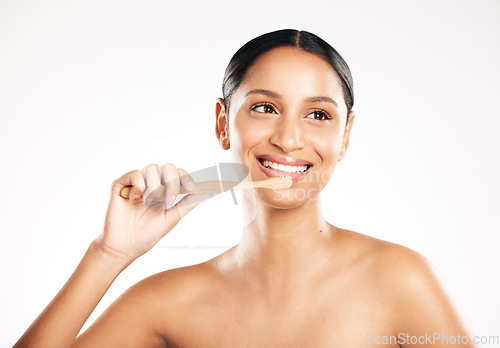 Image of Happy woman, toothbrush and brushing teeth for dental or clean hygiene against a white studio background. Female person or model with tooth brush and smile for oral, mouth or gum care on mockup space