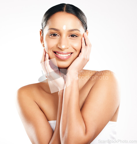 Image of Happy woman, portrait and cream for skincare, beauty or cosmetics against a white studio background. Female person with smile for product, lotion or skin creme in dermatology for facial treatment
