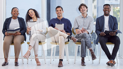 Image of Diversity, portrait of businesspeople sitting and happy waiting in a office at their workplace. Multicultural or corporate, collaboration and smiling colleagues sit on chairs in a boardroom at work