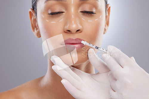 Image of Plastic surgery, aesthetic and lip filler with woman and injection for botox, dermatology and beauty. Pattern, change and medical with model and syringe on grey background for collagen and cosmetics