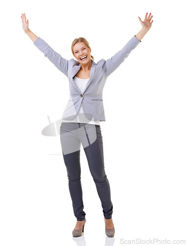 Image of Celebrating her success. A beautiful woman with her arms raised isolated on white.