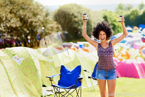 Image of She loves the summer sun. An attractive young woman standing outside during a festival.