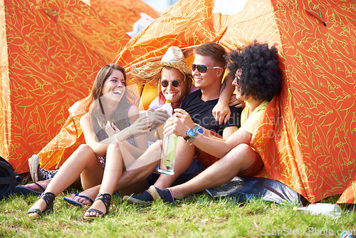 Image of Friends forever. Shot of a group of friends by the campsite at an outdoor festival.
