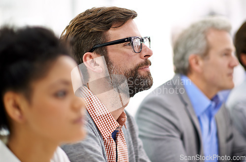 Image of Project debriefing. Shot of a group of dedicated business professionals sitting in a row.