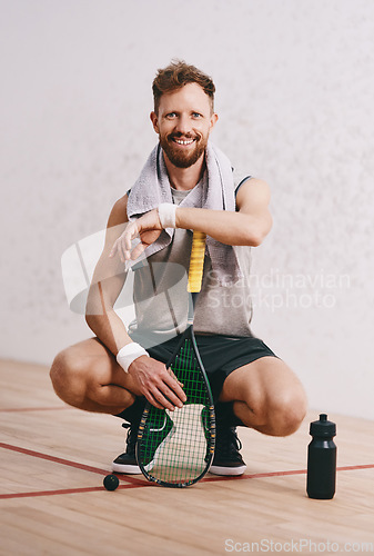 Image of .Portrait of a young man taking a break after playing a game of squash.