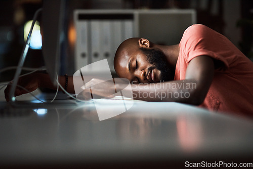 Image of Hes had enough. Cropped shot of a man falling asleep while working late at the office.