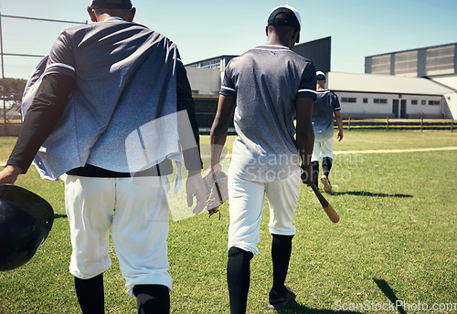 Image of It was a game to remember. Rearview shot of a group of young men walking onto a baseball field.