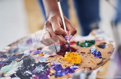 Image of Let the colors inspire you. Cropped shot of an unrecognizable woman holding a painters palette.