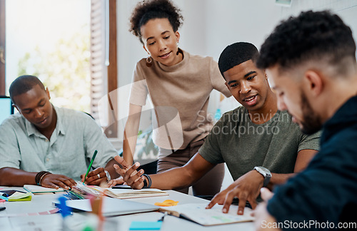 Image of Go getters doing what go getters do best. Shot of a group of young businesspeople having a meeting in a modern office.