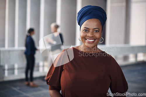 Image of Stand out for what you stand for. Portrait of a confident young businesswoman against a city background.